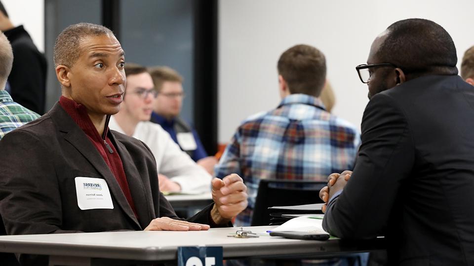 Jesse Salmon consulting with a student